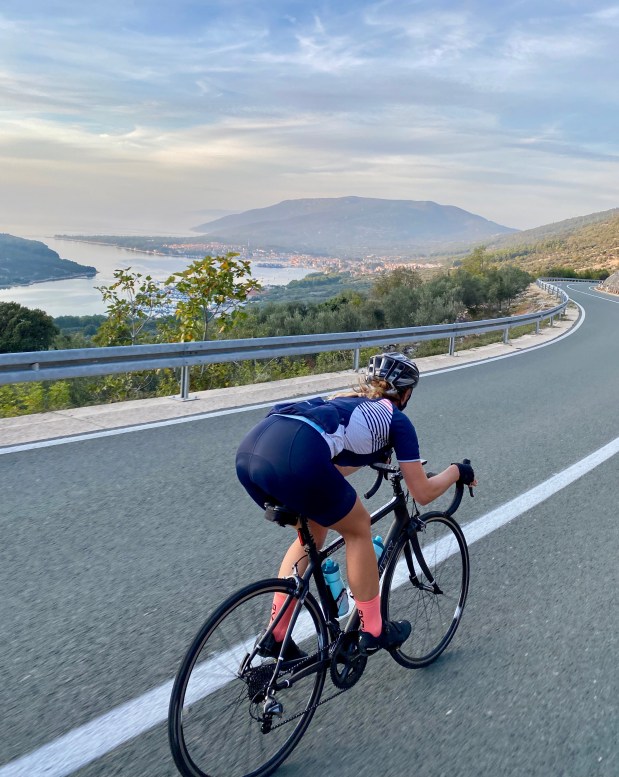 Cyclist descending towards Cres, Cres Island Croatia